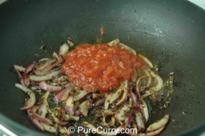 Achari Chicken - Oil, Spices, Onion and Tomatoes